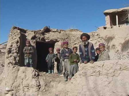 afghan boys and destroyed school